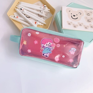 Macro shot of cute cartoon pencil case with sequins and light blue fabric handle detail