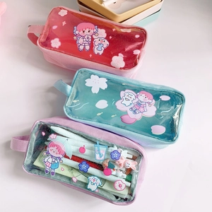 Detail of glitter transparent pencil case featuring cute anime art and side handle strap