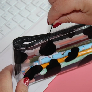 Clear pencil case with black heart patterns and large capacity for school stationery