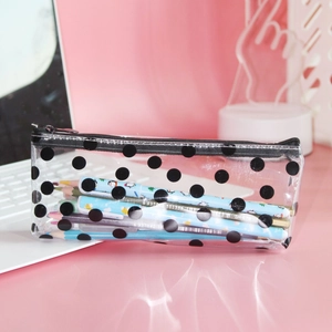 Transparent PVC pencil case with black polka dots showing large capacity for school stationery