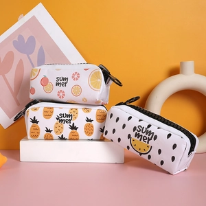 Detail of high-capacity summer fruit print pencil cases with wide zippers and round hooks