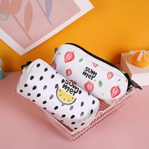 Close-up of strawberry and watermelon patterns on large capacity cylindrical pencil cases