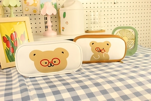 Detail view of cute bear pencil cases with smooth PU leather and zip closure for students