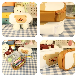 Detail of cute bear pencil case showing internal mesh pocket and large storage capacity