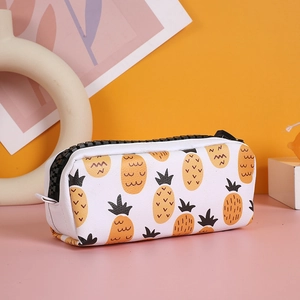 Close-up of cute pineapple print pencil case with large black zipper and side handle