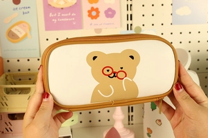 Close-up of cute cartoon bear pencil case with zipper and large storage capacity