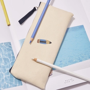 Detail of cream canvas pencil case featuring high-quality pencil embroidery and zipper