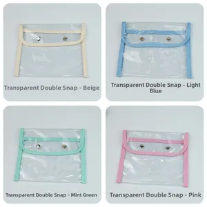 Detailed view of four colorful transparent PVC stationery bags with metal snap closures