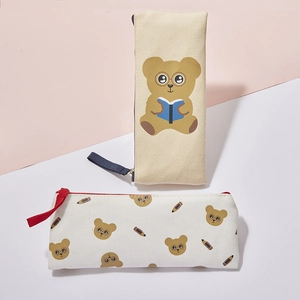 Detail of canvas pencil cases featuring cute bear prints and durable zipper closures