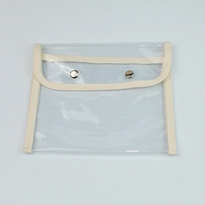 Clear large capacity waterproof pencil case with off-white canvas trim and snap closure