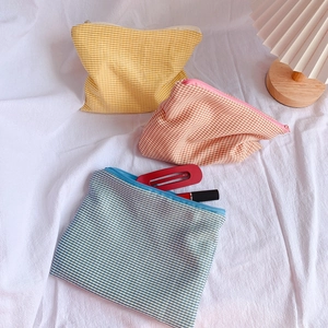 Three-piece set of large capacity checkered pencil cases in yellow, pink and blue
