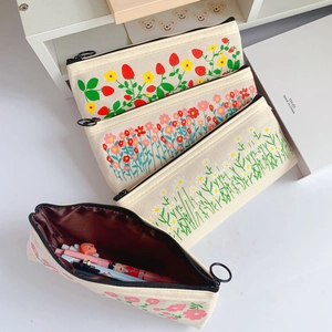Large capacity canvas pencil case with strawberry and floral prints and zipper closure
