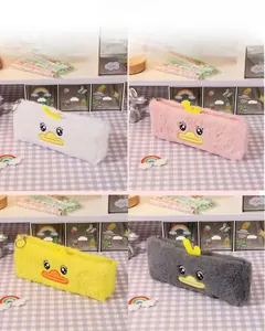 Detailed view of plush duck pencil cases in white, pink, yellow and grey variants