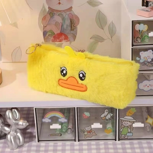 Detailed close-up of fluffy yellow duck plush pencil case with cute embroidery and metal zipper
