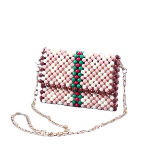 Handmade beaded crossbody bag with elegant wave pattern and stylish chain strap