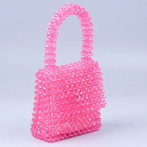 Handmade beaded acrylic handbag in vibrant pink with top handle and magnetic flap closure