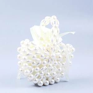 French baroque heart-shaped pearl woven handbag with satin drawstring lining