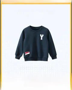 Detail of dark blue kids sweatshirt featuring white Y letter patch and ribbed cuffs