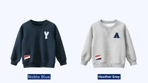 Detail view of two fleece-lined sweatshirts in royal blue and grey with letter appliques