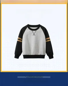 Detail of color-block raglan sleeves and ribbed cuffs on kids long sleeve sweatshirt