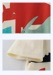Detailed view of colorful cartoon dinosaur print and double-stitched cotton sleeve cuff