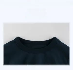Detailed close-up of the durable crew neck stitching on this navy blue dinosaur t-shirt
