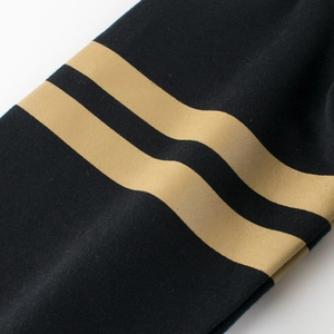 Kids black cotton sweatshirt sleeve featuring double gold stripes in casual sporty style