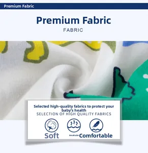 Close-up of soft breathable cotton fabric with colorful cartoon dinosaur patterns