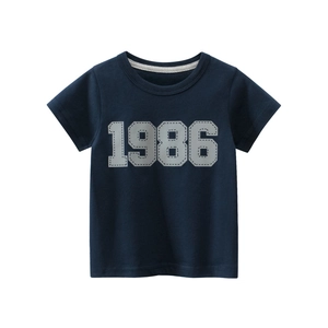 Classic navy blue cotton t-shirt for boys with 1986 graphic print on a white background