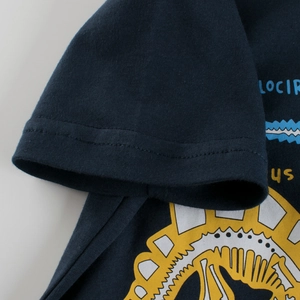 Navy blue kids cotton t-shirt featuring a cartoon dinosaur print and high-quality stitching