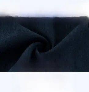 Vue détaillée du tissu en maille respirant bleu foncé pour t-shirt enfant en coton
