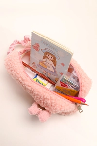 Pink plush pencil case with stationery inside, featuring soft sheep wool texture detail