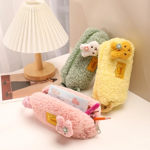 Three colorful plush pencil cases with cute animal charms and macaron soft colors