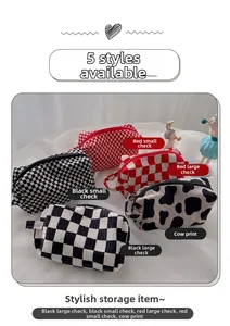 Detailed collection of velvet checkered and cow print cosmetic bags with side handles