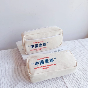 Close-up of canvas stationery bag with vintage Chinese typography and durable zipper