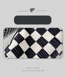 Detail of vintage checkerboard velvet fabric showing soft texture and fine stitching
