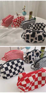 Detailed view of checkered and cow print velvet pouches with soft 3D bubble texture