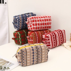 Knitted Christmas makeup bags with festive Nordic snowflake and plaid patterns