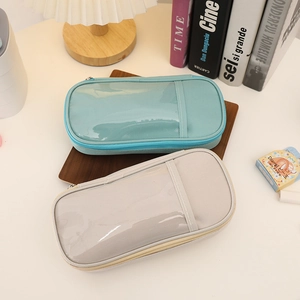 Detailed view of large capacity canvas pencil cases with transparent window on a desk