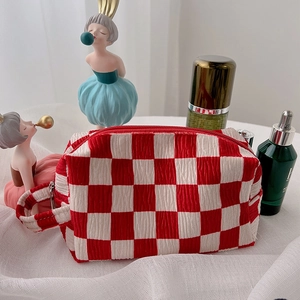Cute red and white checkered velvet makeup bag with bubble texture and convenient handle