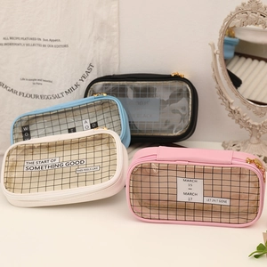 Detail of grid transparent stationery bags in pink, cream, blue, and black colors