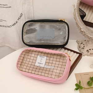 Detail of pink and black large capacity pencil cases with mesh windows and gold zippers