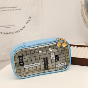 Detail of light blue PU pencil case featuring a black mesh window and dual gold zippers