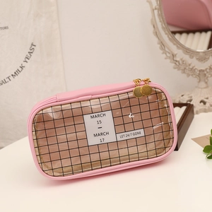 Detail view of pink large capacity pencil case with mesh window and gold zipper pulls