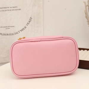 Detailed view of the large capacity pink pencil case with golden zippers and soft texture