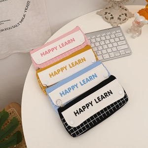 Close-up of double-layer plaid pencil case with metal zipper and snap button flap
