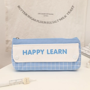 Detail of blue canvas pencil case featuring Happy Learn print and double layers