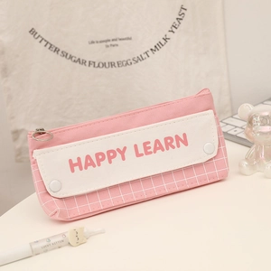 Detail of a large capacity pink checkered pencil case with Happy Learn text and metal zipper