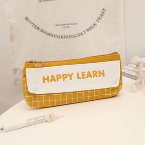 Detail of a large capacity yellow checkered pencil case with Happy Learn text print