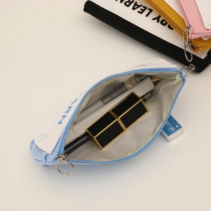 Detail view of large capacity light blue canvas stationery bag with wide zipper puller